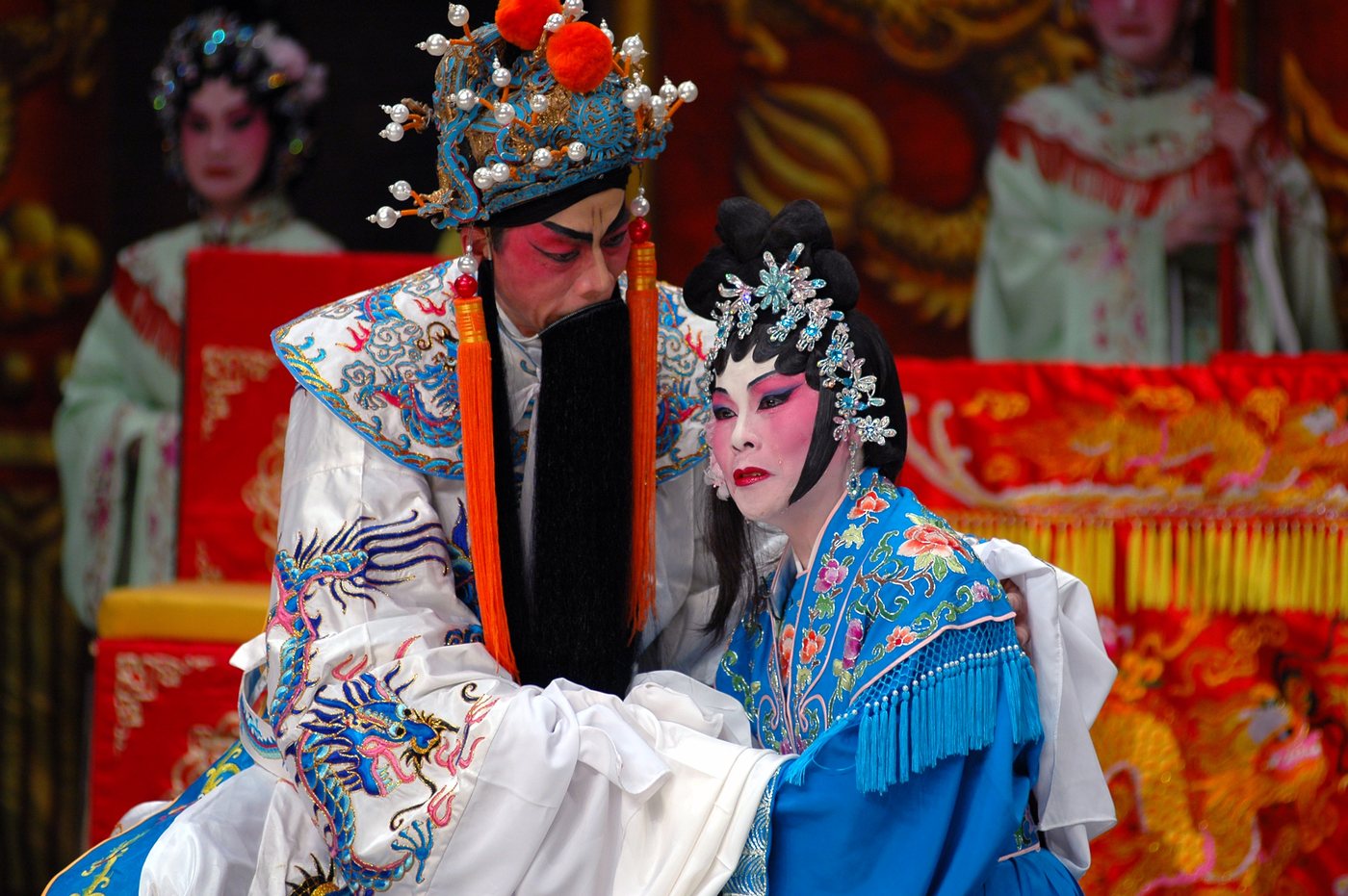 A performer in full costume and headdress